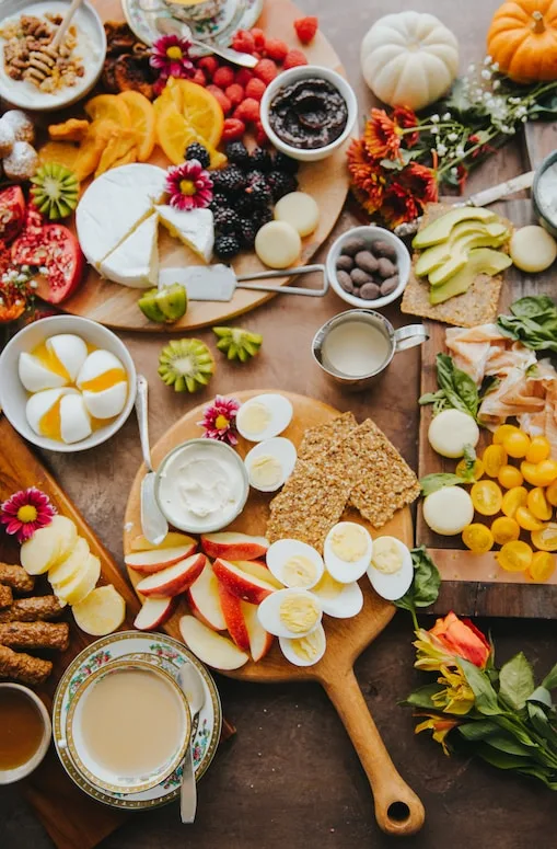 A sharing board of eggs, cheese, fruit and crackers